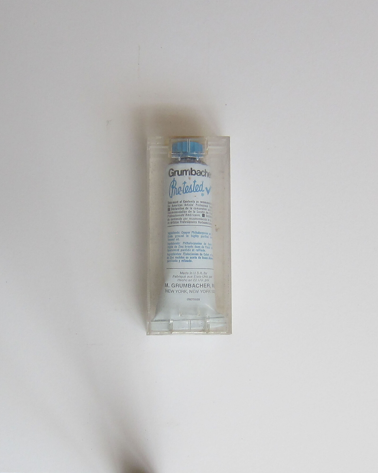 Studio Materials, Unopened clear plastic box with tube of Grumbacher Oil Color in the shade "Cerulean Blue" inside.